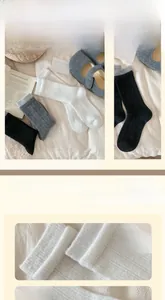 Detailed knit texture of wool socks paired with cozy grey slippers for winter comfort