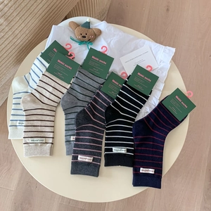Set of six striped wool socks for women in various colors with letter patches