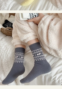 Detail of Nordic grey thermal socks with puppy and snowflake jacquard patterns