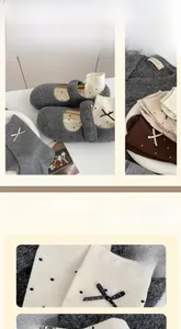Detail of wool socks featuring cute bow ties and elastic anti-slip cuffs in autumn colors