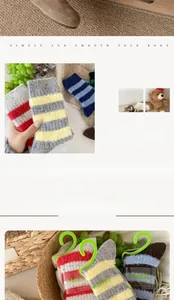 Detail of chunky wool socks with striped patterns and contrast cuffs for winter warmth