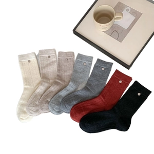 7-pack warm wool knit mid-calf socks with ribbed texture and metal button accents