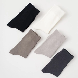 Five pairs of men's mid-calf cotton socks in black white and grey with ribbed texture
