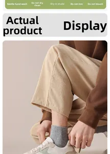 Detailed texture of beige corduroy trousers with laundry care icons for autumn wear