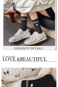 Exquisite details of dark grey knit crew socks with white stripes and animal embroidery