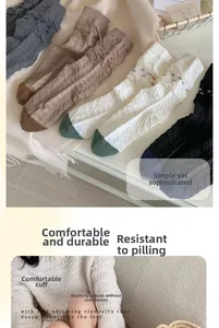 Detailed close-up of ribbed cotton crew socks featuring floral patterns and elastic cuffs
