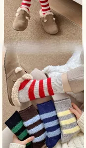 Detailed view of thick striped wool socks in mink plush with fleece lining for winter warmth