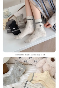 Detail of Korean style animal embroidery on vintage flecked cotton crew socks