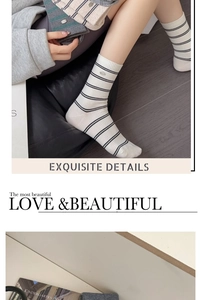 Detailed close-up of striped cotton crew socks with ribbed cuffs and stylish metal buckle