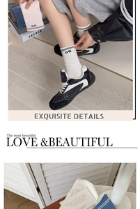 Detail of college style mid-tube cotton socks with 05 varsity number and striped rolled cuffs
