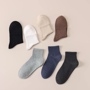 Set of seven pairs of men's cotton crew socks in assorted neutral colors with ribbed cuffs