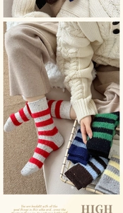 Close-up of thick striped wool mink socks with fuzzy texture and colorful cuffs
