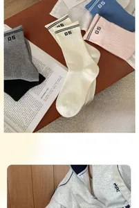 Detail of multi-color cotton socks with elastic ribbed cuffs and number 05 print