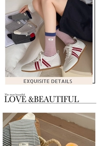 Detail of striped cotton mid-tube socks with egg label paired with white sneakers