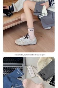 Detail of 05 number embroidery on ribbed cotton crew socks for women in sporty style