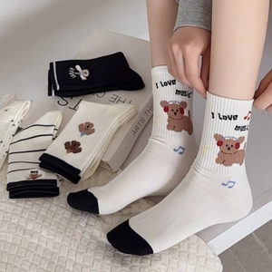 Women's cotton crew socks with cute cartoon puppy patterns and stylish stripes