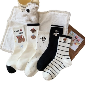 Cotton crew socks set featuring cute puppy patterns with stripes and polka dots