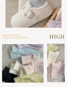 Close-up of soft mink velvet socks with handmade lace labels in pastel macaron colors