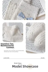 Detail of seamless toe and reinforced heel on cream cotton socks with blue bows