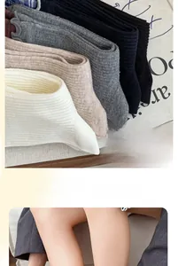 Detail of ribbed knit cotton socks in various neutral colors for a soft and casual look