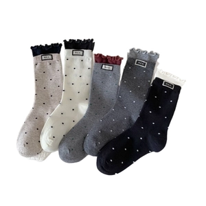 Five-pack set of polka dot cotton crew socks with ruffled cuffs and M.E.K. fabric labels