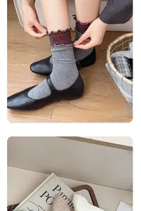 Detail of grey cotton socks with red plaid ruffle trim and comfortable elastic cuff