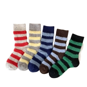 Five pairs of thick striped wool blend winter socks with fuzzy texture in various colors