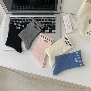 Five pairs of casual cotton crew socks for women featuring sporty number 05 print and stripes
