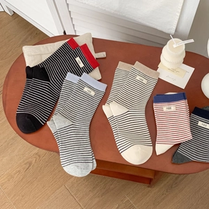 Five pairs of Japanese style striped cotton crew socks with minimalist egg fabric labels