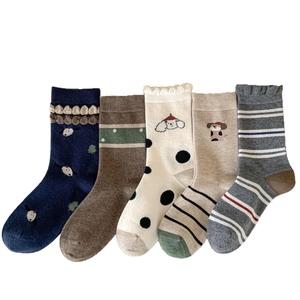 Five pairs of thick wool crew socks for women featuring cute cartoon puppy patterns