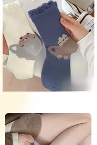 Detail of cute animal socks showing high elastic wavy cuff and cotton texture close-up
