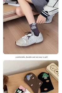 Detailed view of cute cotton mid-calf socks with cartoon bear and heart patterns