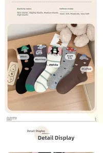 Detailed set of 5 cotton knit socks with cute cartoon patches on a wooden background