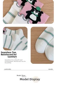 Detailed close-up of seamless toe stitching on pink and striped cotton baby socks