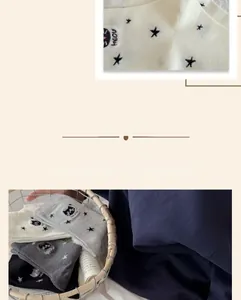 Gros plan détaillé de la broderie chat et des motifs étoiles sur chaussettes en coton