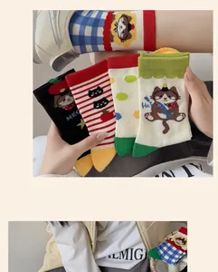 Detail showing various colors of cat pattern socks with wide elastic ribbed cuffs