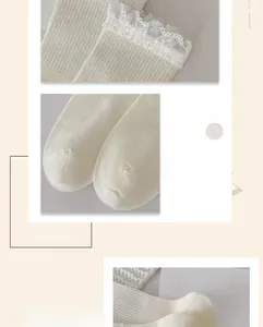 Detail of cream rib knit socks featuring white lace trim and seamless toe stitching