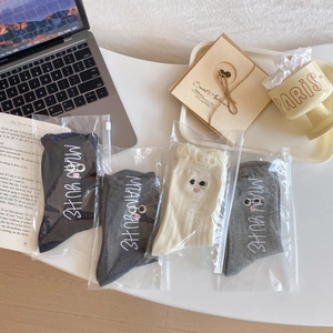 Detailed set of four rib-knit crew socks with cute embroidery in clear zipper pouches