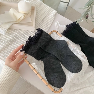 Women's rib knit socks with lace trim and hollow design in black, grey, and cream white
