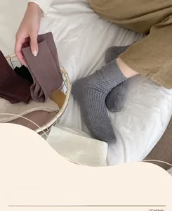 Detail of ribbed knit cotton socks in earthy tones showing soft texture and premium weave
