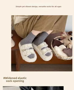 Detail view of the wide elastic cuff on gray ribbed knit thermal socks for women