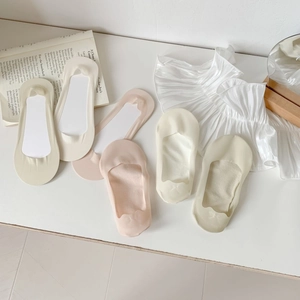 Detailed view of lightweight ice silk no-show socks in soft pastel beige and pink tones