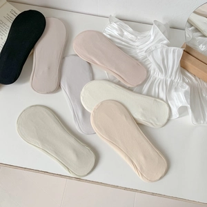 Macro view of seamless ice silk no-show socks in various soft Morandi colors