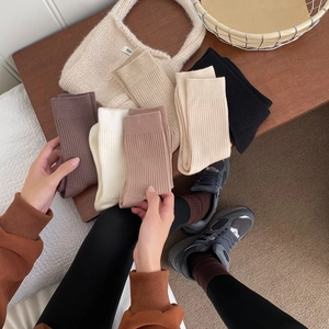 Assorted winter cashmere-style mid-calf crew socks in retro earthy brown tones