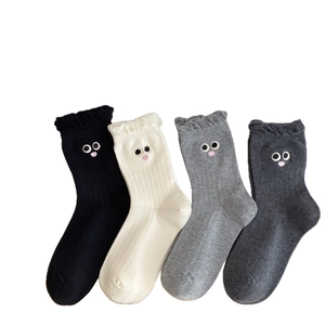 Four pairs of cotton crew socks with ruffled edges and cute cartoon eye embroidery