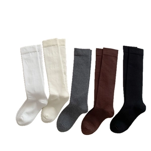 Five pairs of knee-high cotton socks in white, beige, grey, brown, and black colors