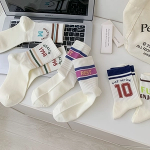 Retro American style mid-calf socks in off-white cotton with colorful athletic stripes