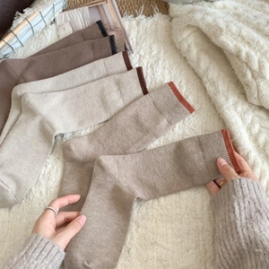 Five pairs of warm vintage cashmere-style crew socks in earthy brown and beige tones