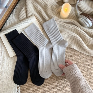 Cozy knit rib crew socks in black and grey for men, ideal for warm winter comfort