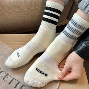 Mid-calf cotton socks in cream with black stripes and thick cushioned terry soles